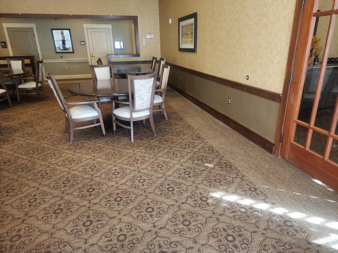 Restored assisted living room with new carpet and trim