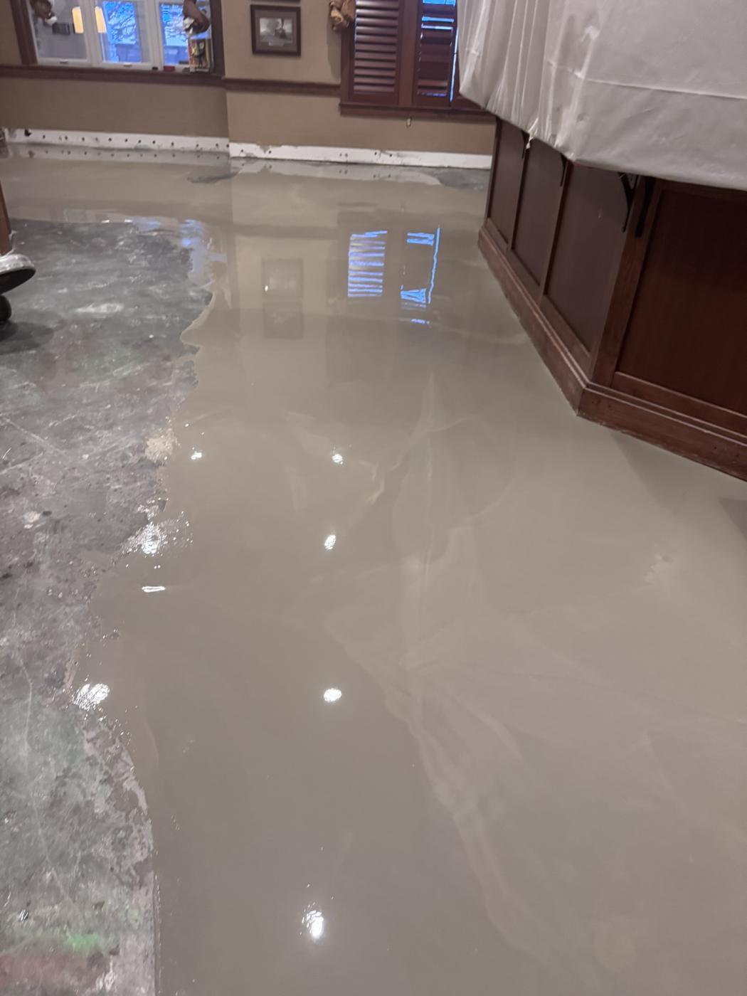 Flood-damaged room stripped to the bare floor