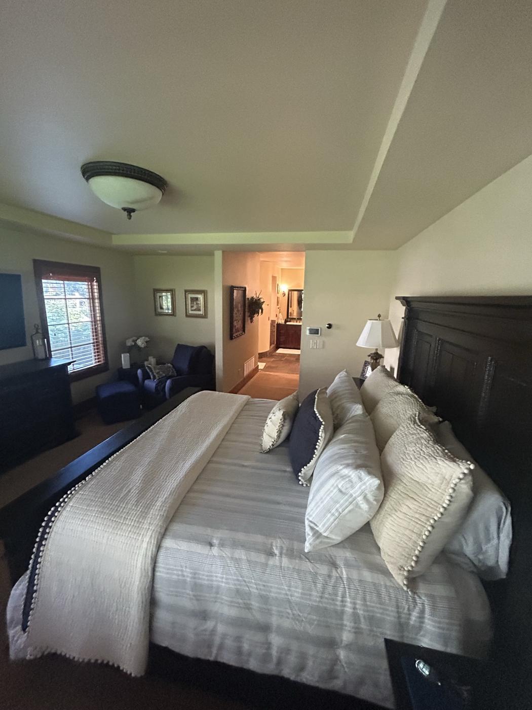 Bedroom before the remodel with carpet