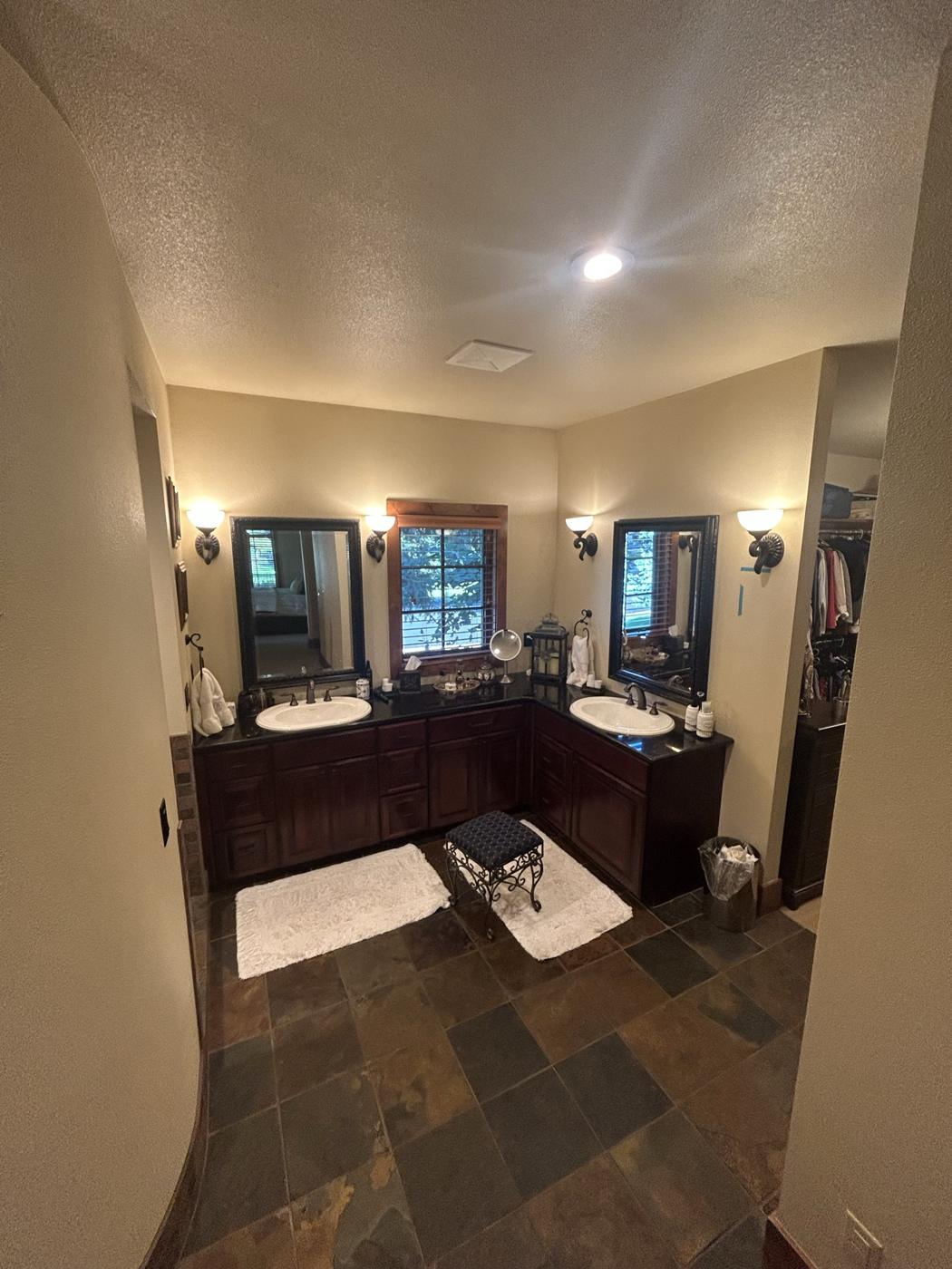 Original dark wood vanity and slate floor