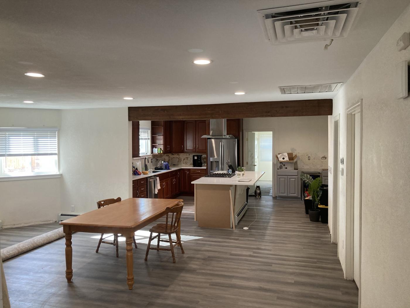 Open kitchen and dining area after a wall was removed