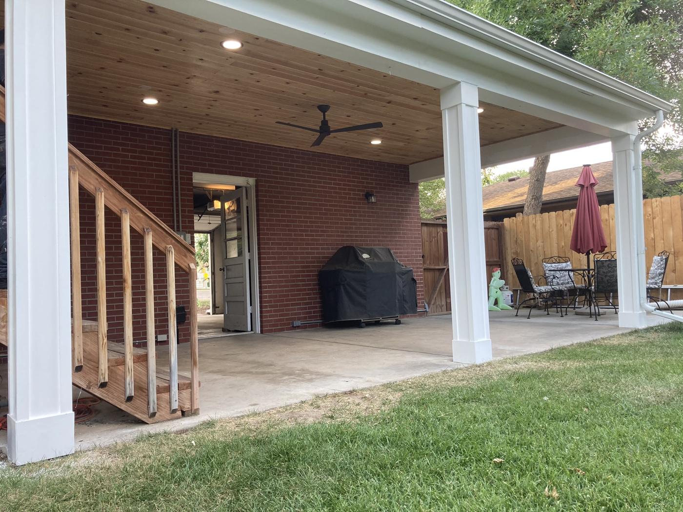 Covered patio with cedar ceiling and posts over a new concrete pad