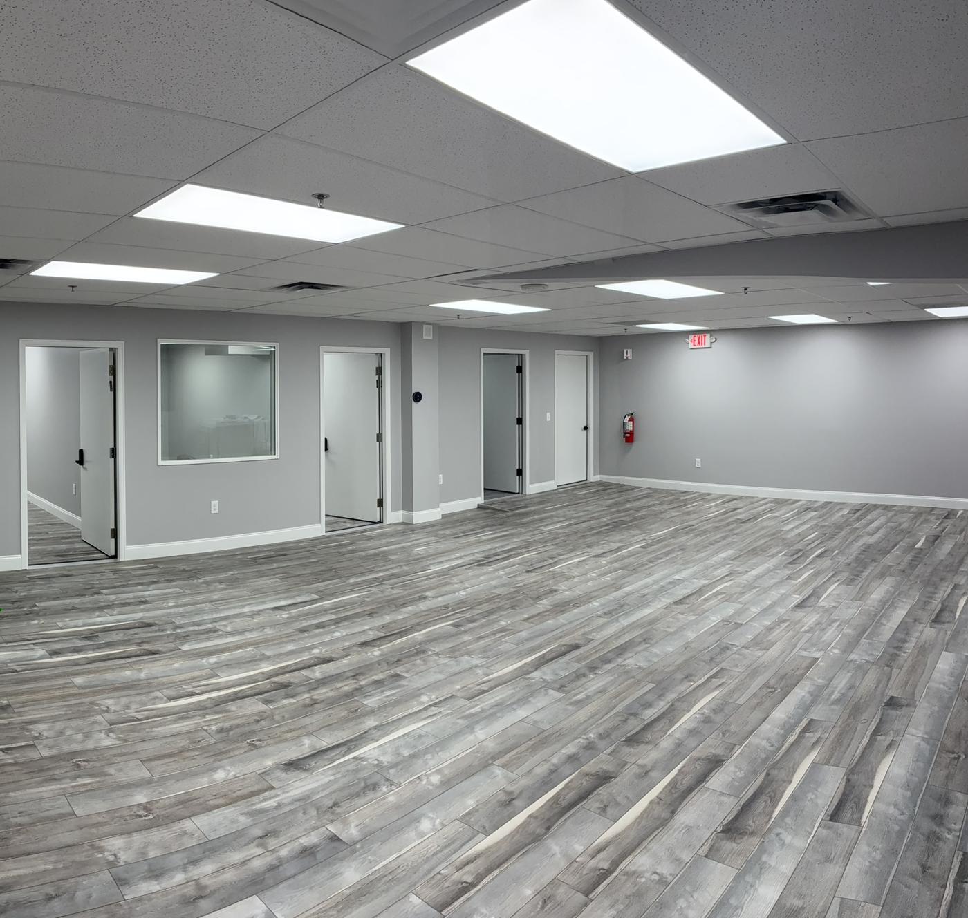 Finished Impact Church space in Commerce City with new floors, ceiling and lighting