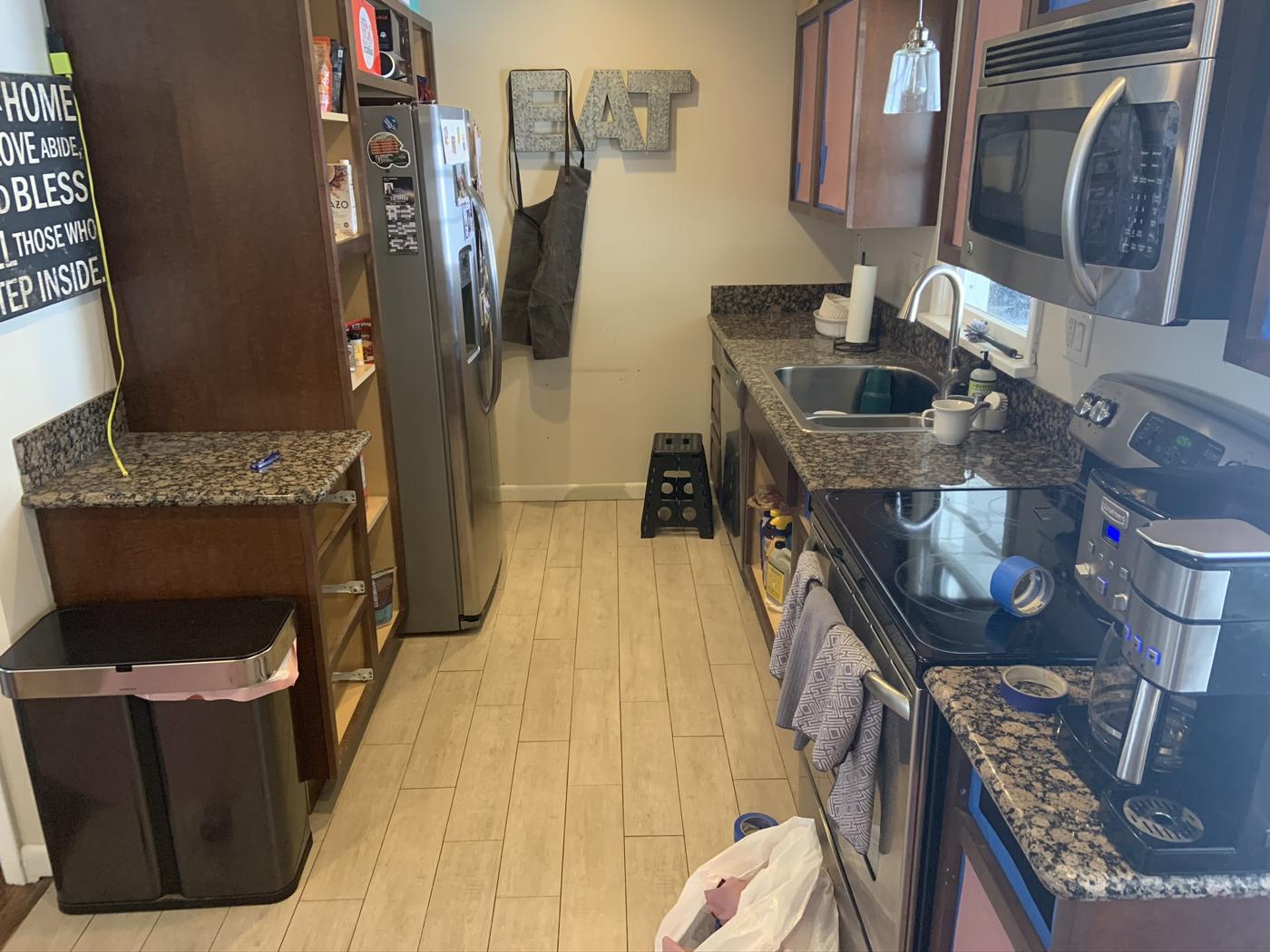 Kitchen before with dark cabinets